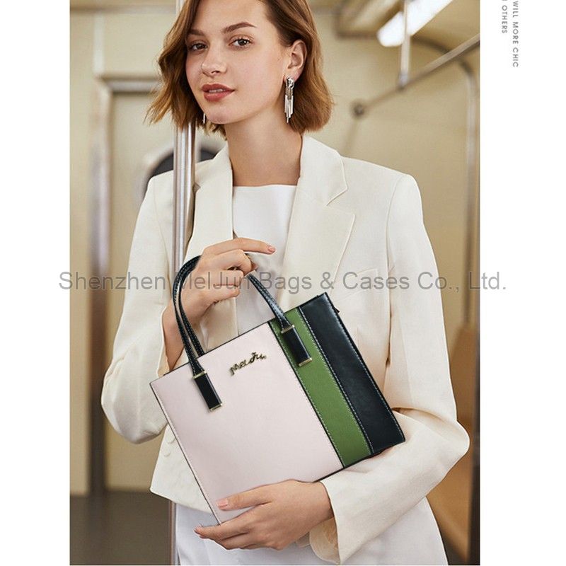 The modern fashion trend is simple, light and luxurious. Women's commuting color hand bill shoulder oblique straddle bag
